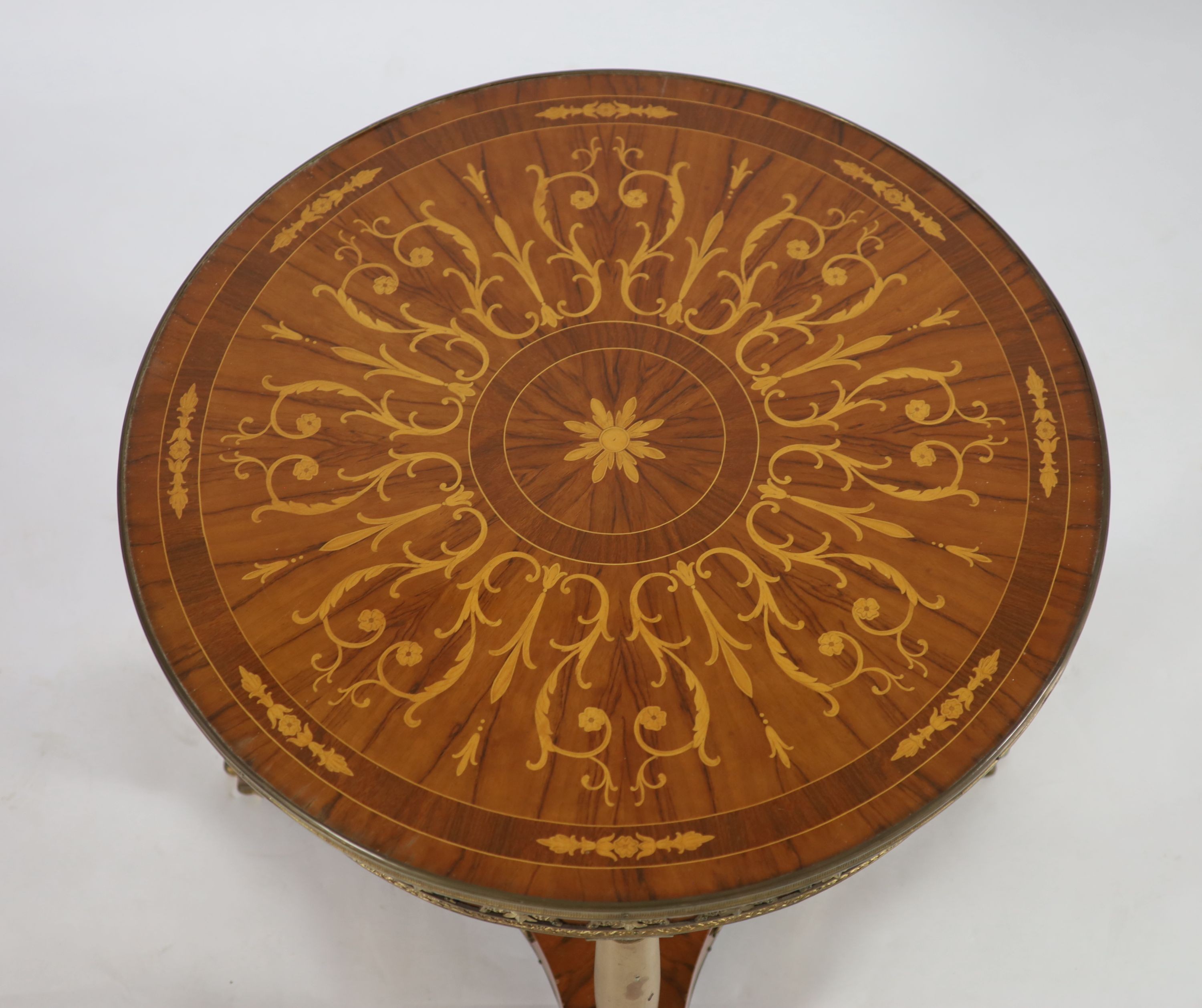 A French empire style ormolu mounted marquetry centre table Diam.81cm H.65cm